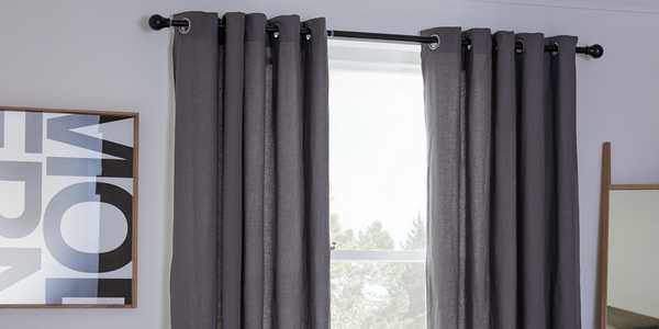Grey curtains in a bedroom.